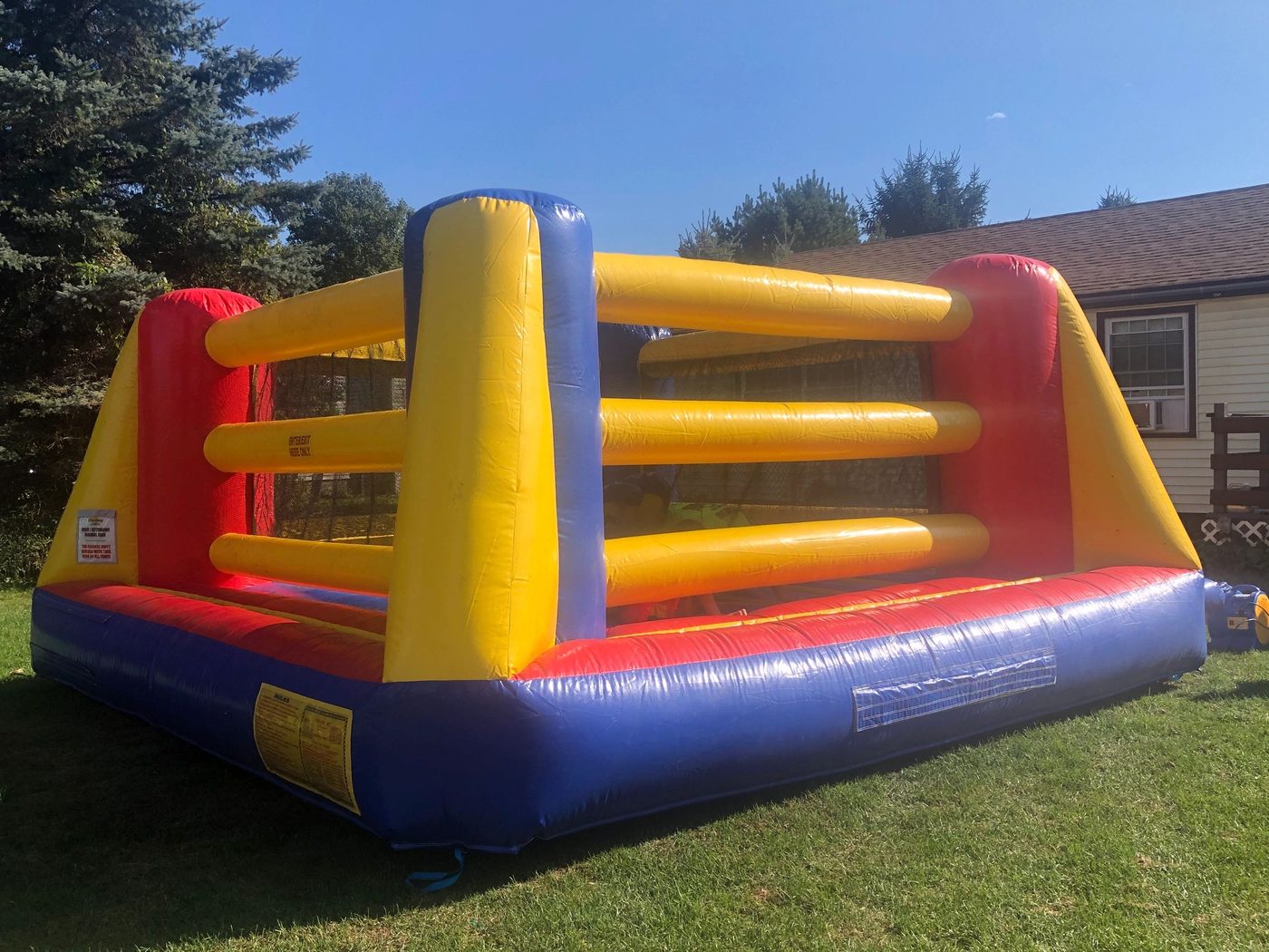Inflatable boxing ring set up in a backyard