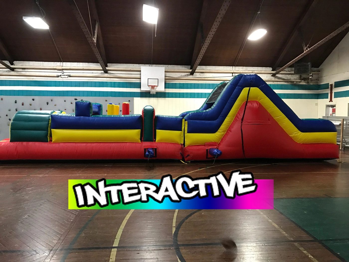 Just Bounce Around interactive obstacle course set up indoors in a gym